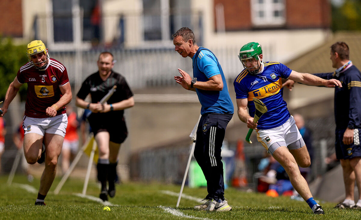 Tipperary's Noel McGrath runs around Wesmeath's manager Sean O’Brien. Picture: INPHO/Tommy Dickson