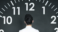 Business Woman Looking Clock