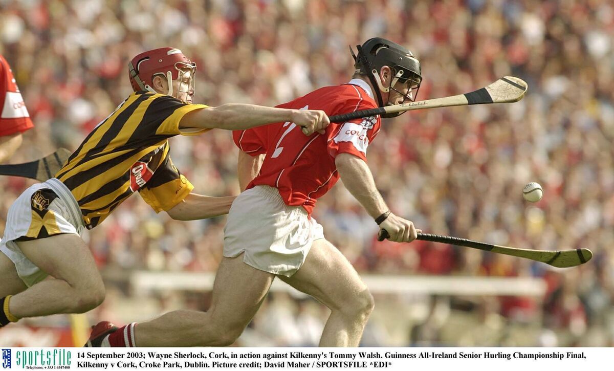 Wayne Sherlock, Cork, tries to avoid the tackle of Kilkenny's Tommy Walsh in the 2003 All-Ireland hurling final at Croke Park. Picture: David Maher/SPORTSFILE