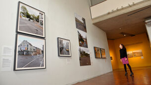 <p>Mary McCarthy, Director, Crawford Art Gallery with an exhibition by photographer Dara McGrath called For Those That Tell No Tales. Picture: Larry Cummins</p>