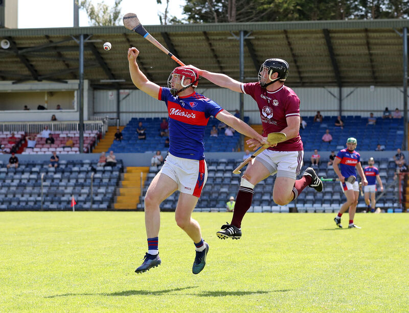 Bishopstown's Shane O'Neill rises for the ball against Sam Guilfoyle of Erin's Own. Picture: Jim Coughlan. Bishopstown's Shane O'Neill rises for the ball against Sam Guilfoyle of Erin's Own. Picture: Jim Coughlan.