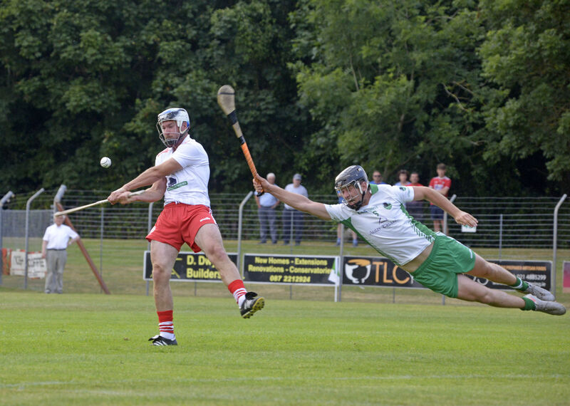 Alan O'Shea for Muskerry diving to stop the shot of Cian McCarthy. Picture: Denis Boyle Alan O'Shea for Muskerry diving to stop the shot of Cian McCarthy. Picture: Denis Boyle