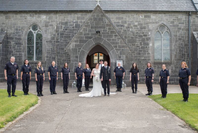 GUARD OF HONOUR: Their Civil Defence friends and colleagues met them with a guard of honour outside the church entrance. GUARD OF HONOUR: Their Civil Defence friends and colleagues met them with a guard of honour outside the church entrance.