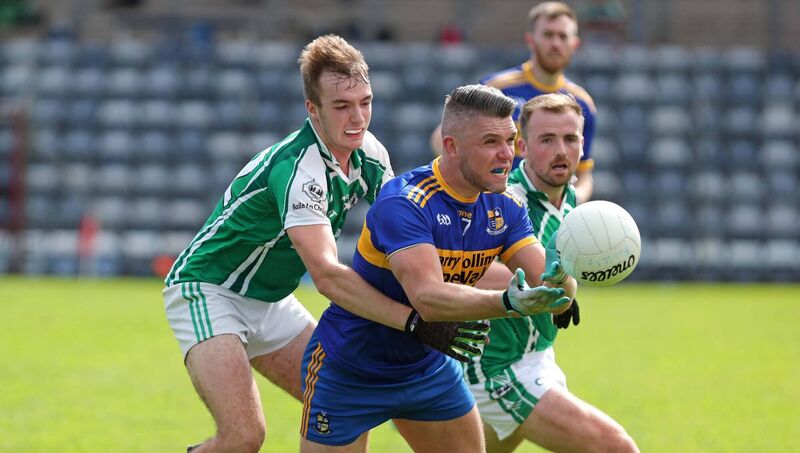 Evan Cooke and Cian Dorgan, Ballincollig, tackle Stephen Dwane, Carrigaline. Picture: Jim Coughlan. Evan Cooke and Cian Dorgan, Ballincollig, tackle Stephen Dwane, Carrigaline. Picture: Jim Coughlan.