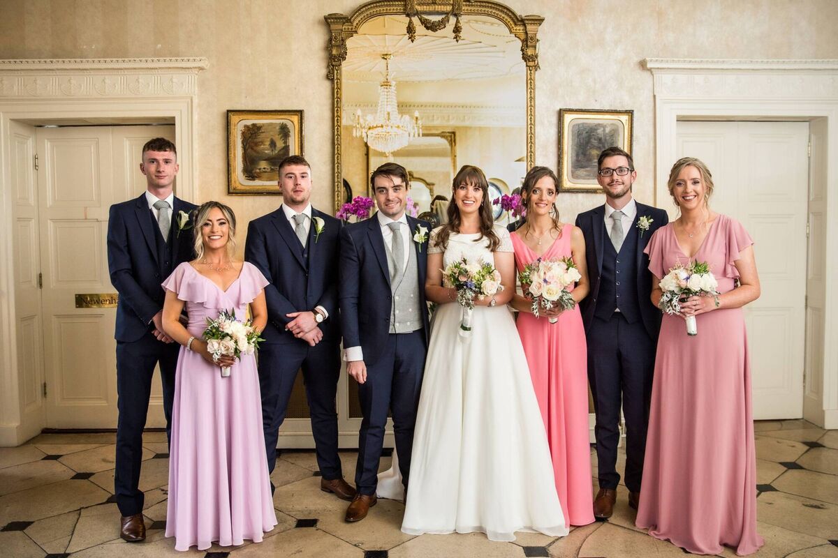 The bride and groom with their wedding party. The bride and groom with their wedding party.