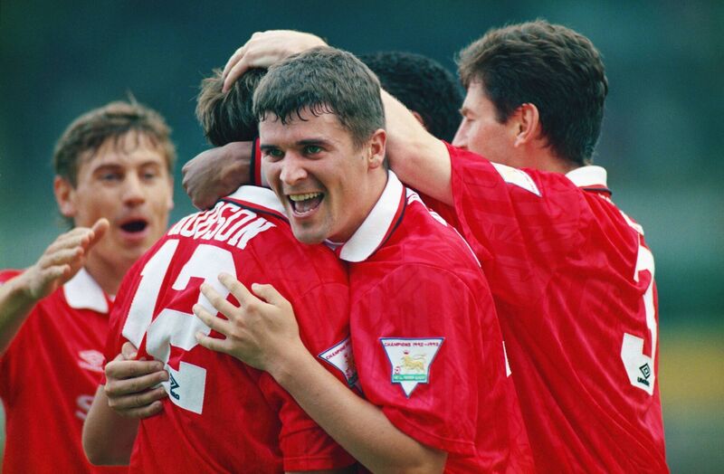 Manchester United player Roy Keane (c) celebrates a goal by Bryan Robson (12) against Norwich City in August 1993. Picture: Shaun Botterill/Allsport/Getty Images