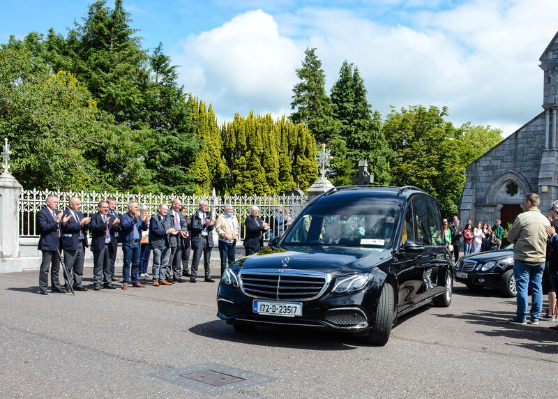 Mark Wills' hearse is given a Guard of Honour from members of Highfield RFC and Bus Eireann following his Funeral Mass in the Church of St Ann and St John in Ballincollig. Picture: Howard Crowdy