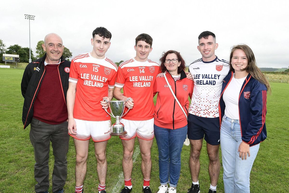 Ian and Chris Óg Jones with family members after Iveleary's victory in the JAFC final. Picture: John Tarrant