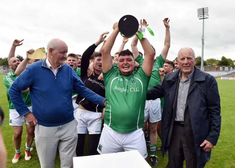 Araglen's captain Oisin Hickey with Pat Horgan, Vice chairman County board and Mick Lyons ,club delegate after defeating Freemount in the Co-Op Superstores J'B' HC 2020 final at Pairc Ui Rinn . Picture: Eddie O'Hare