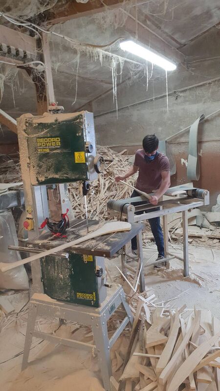 Eugene Sweeney crafting a hurley in his workshop.