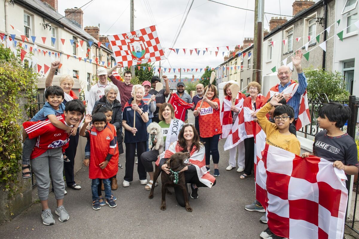83-year-old Marie Finn neighbour and Limerick supporter Joan Leddin (green) and her neighbours of Annmount, Friar’s Walk. 
