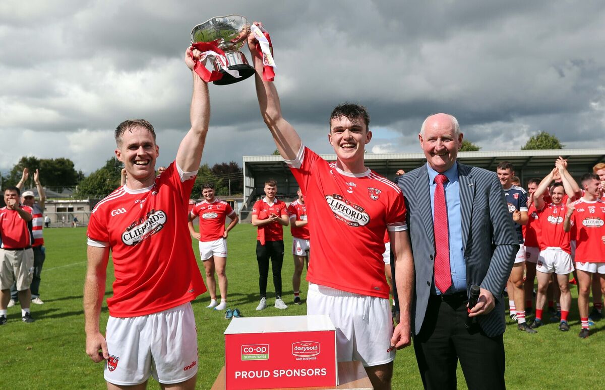 Brian Lawton and Daragh Moran, Castlemartyr, receive the cup from Pat Horgan, vice-chairperson Cork County Board. Picture: Jim Coughlan. Brian Lawton and Daragh Moran, Castlemartyr, receive the cup from Pat Horgan, vice-chairperson Cork County Board. Picture: Jim Coughlan.
