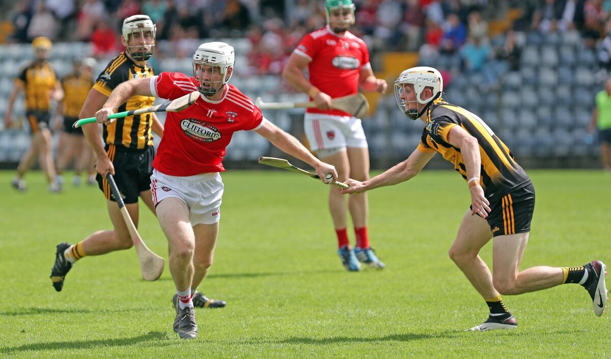 Luke Duggan Murray, Russell Rovers, battles Barry Lawton, Castlemartyr. Picture: Jim Coughlan. Luke Duggan Murray, Russell Rovers, battles Barry Lawton, Castlemartyr. Picture: Jim Coughlan.