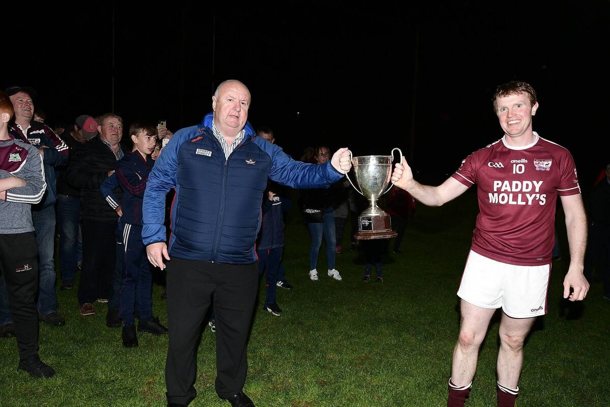 Rockchapel captain Kevin Collins accepts the 2020 Bon Secours Co IAFC Cup from Noel O'Callaghan. Picture: John Tarrant 