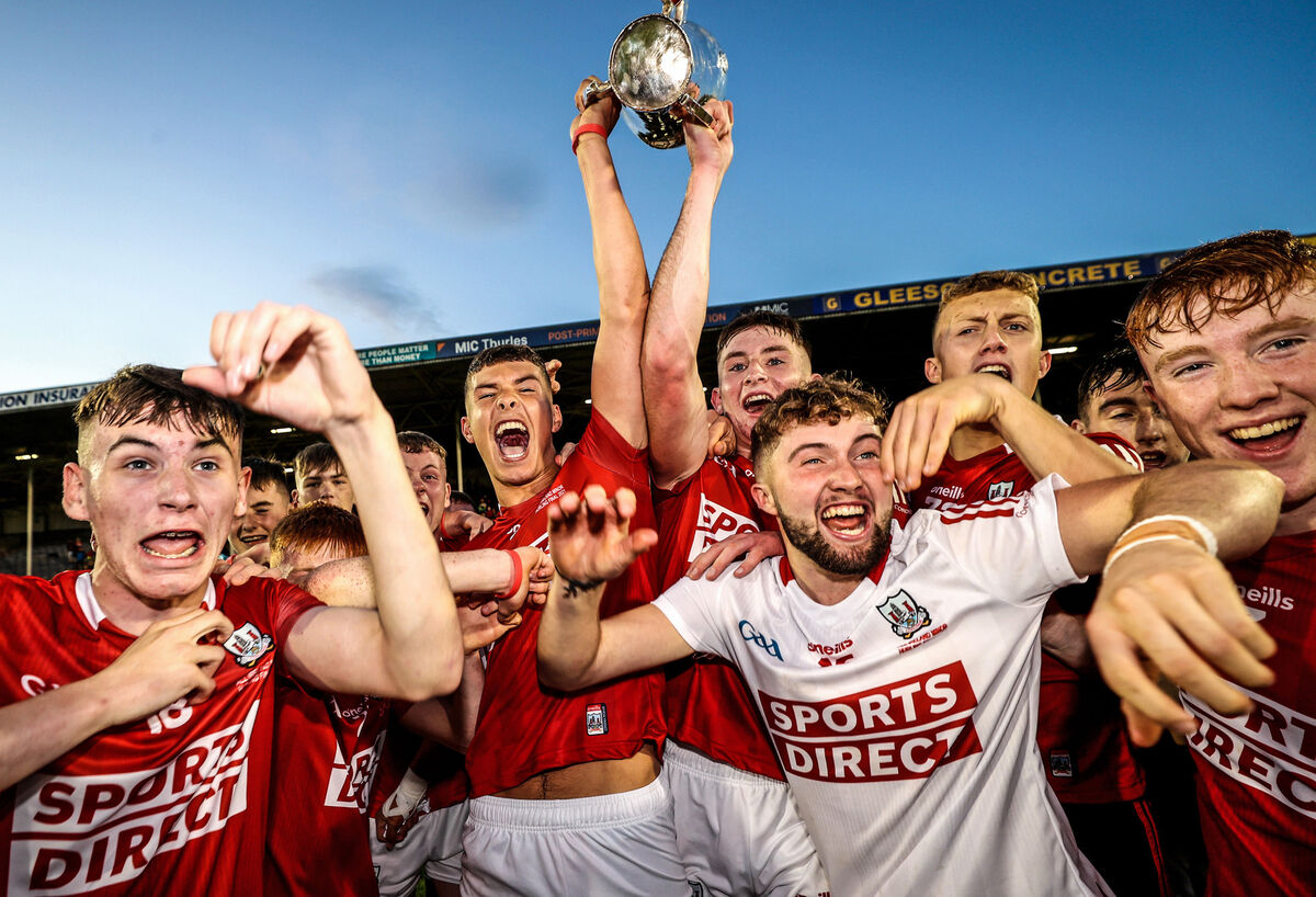 Cork’s joint captains James Dwyer and Ben O’Connor lift the trophy. Picture: INPHO/James Crombie