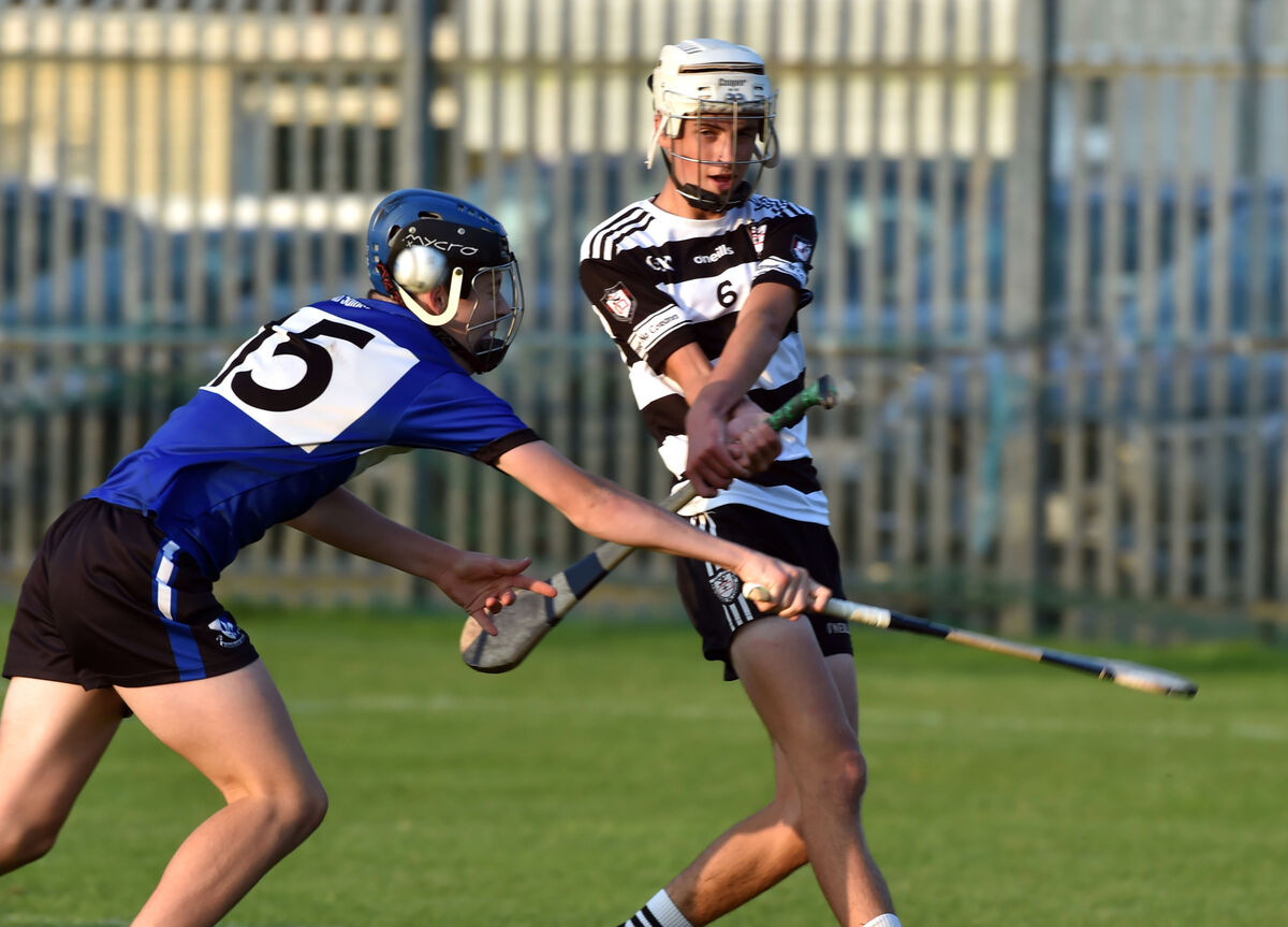 Midleton's Carthaigh Cronin clears from Sarsfields Barry O'Flynn during the John West Feile Cork premier 1 final at Douglas. Picture: Eddie O'Hare