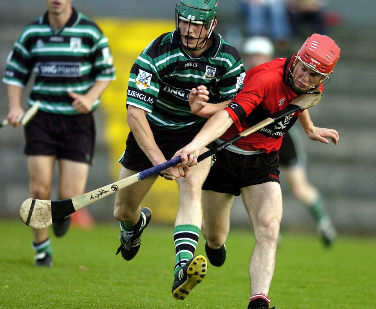 Eoin Cadogan, Douglas, battles Tommy Walsh, UCC. Picture Maurice O'Mahony