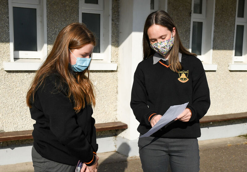 1st year student Aoibhinn O'Hagan from Rathcormac, getting some information from 5th year student Sarah Ahern, at Colaiste an Chroi Naofa, Carraig na bhFear, Co Cork. 1st year student Aoibhinn O'Hagan from Rathcormac, getting some information from 5th year student Sarah Ahern, at Colaiste an Chroi Naofa, Carraig na bhFear, Co Cork.