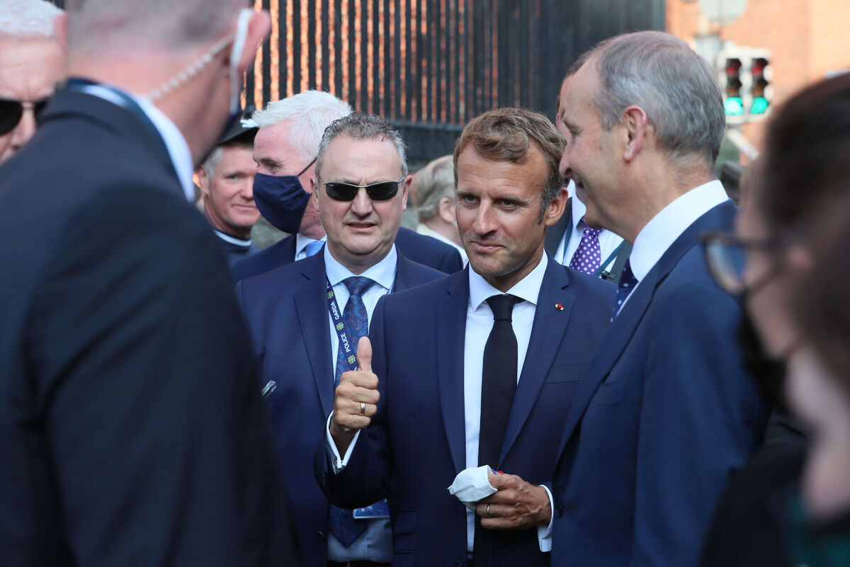 French President Emmanuel Macron with Taoiseach Micheál Martin while on a walkabout in Dublin city centre, during his first official visit to Ireland. Picture date: Thursday August 26, 2021. PA Photo. The visit fulfils part of an election pledge by Mr Macron to visit all 27 EU member states, with Ireland one of only four countries yet to be crossed off his list. See PA story IRISH Macron. Photo credit should read: Brian Lawless/PA Wire