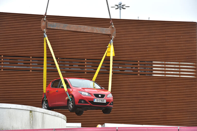  A car is hoisted from the car park on the roof of Douglas Village Shopping Centre, Douglas, Cork which was damaged by a large fire in 2019. Picture Dan Linehan