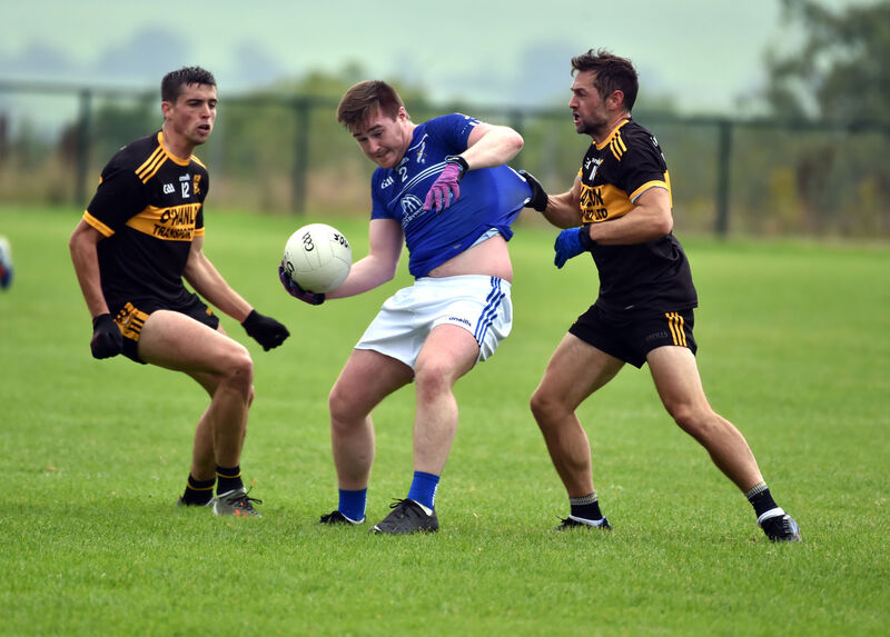 Bantry Blues' Tim Cronin is tackled by Clyda Rover's Paul Cronin and Niall Hanley. Picture: Eddie O'Hare Bantry Blues' Tim Cronin is tackled by Clyda Rover's Paul Cronin and Niall Hanley. Picture: Eddie O'Hare