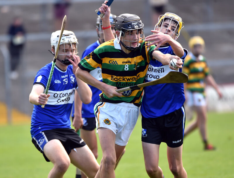 Glen Rovers' Michael Tadgh Brosnan breaks from Sarsfield's Sean Bracken and Sam Allen. Picture: Eddie O'Hare