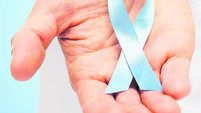 doctor hand with prostate cancer awareness ribbon