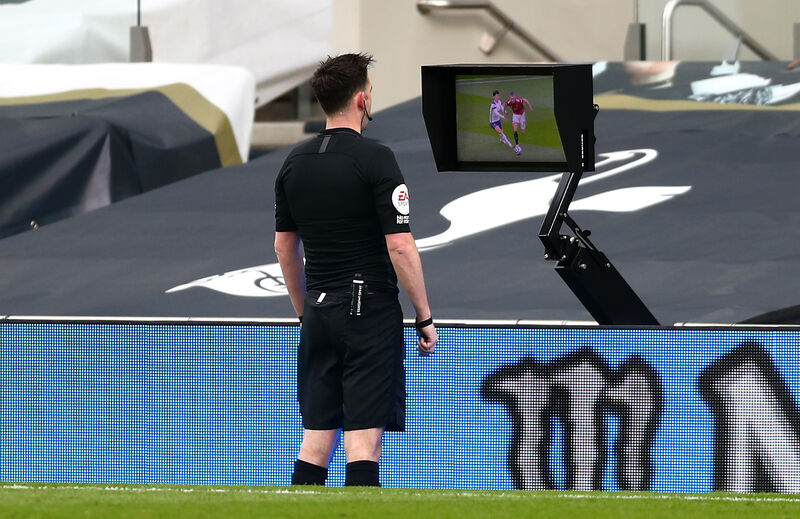 Referee Chris Kavanagh consults the pitch-side VAR screen during a Premier League game. Picture: James Warwick