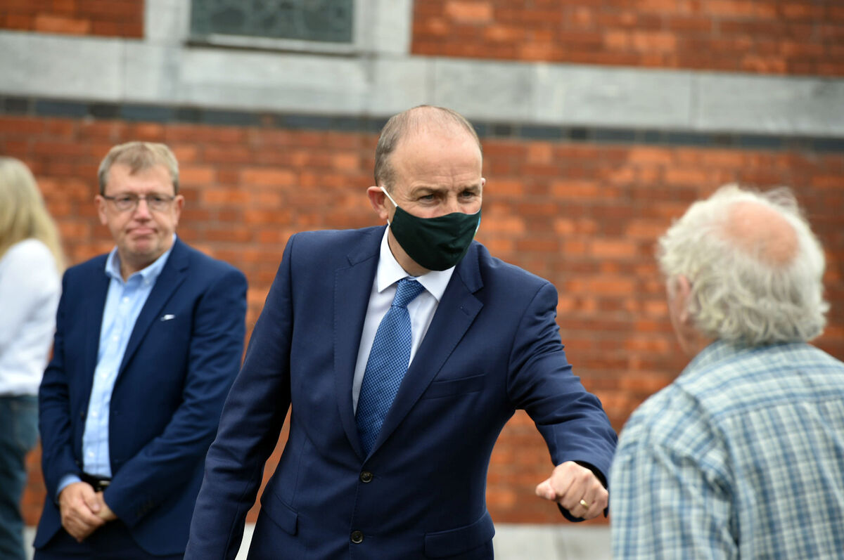 Cllr Tony Fitzgerald and Taoisech Micheal Martin after the remains of Billa O’Connell are removed from The Lough Church. Picture: Michael Mac Sweeney/Provision Cllr Tony Fitzgerald and Taoisech Micheal Martin after the remains of Billa O’Connell are removed from The Lough Church. Picture: Michael Mac Sweeney/Provision