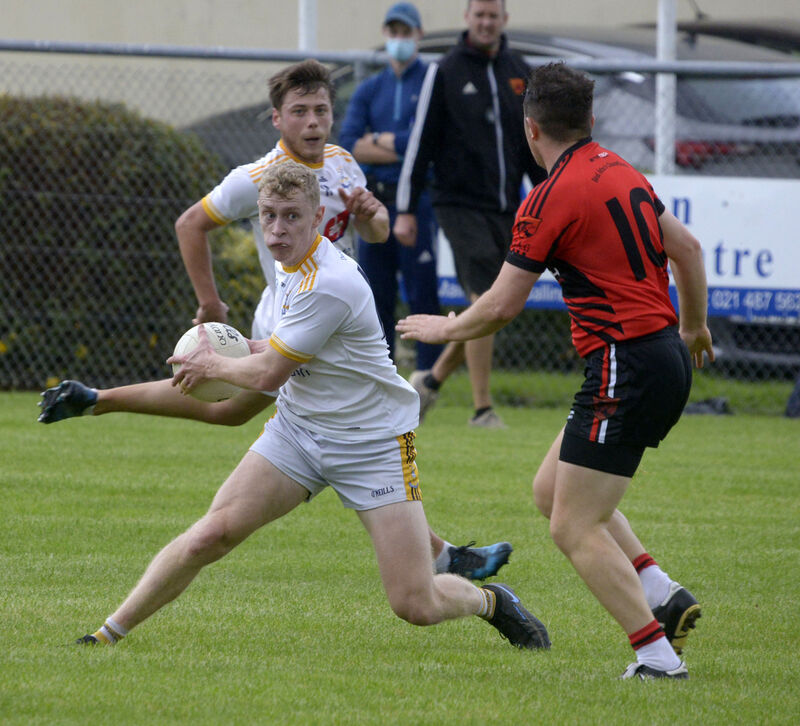 Bandon's Conor Calnan avoiding the challenge of Ballingeary's Liam Shorten. Picture: Denis Boyle Bandon's Conor Calnan avoiding the challenge of Ballingeary's Liam Shorten. Picture: Denis Boyle