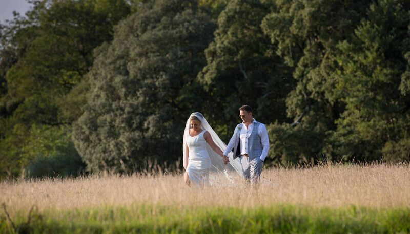 The couple walk hand in hand around the grounds of Castlemartyr Resort, where they wed. The couple walk hand in hand around the grounds of Castlemartyr Resort, where they wed.