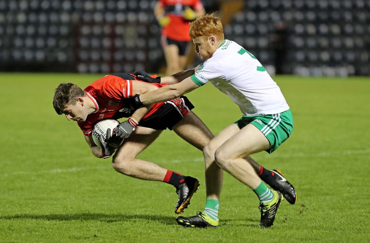 Conor Greaney, UCC, battles William Ronan, Muskerry. Picture: Jim Coughlan. Conor Greaney, UCC, battles William Ronan, Muskerry. Picture: Jim Coughlan.