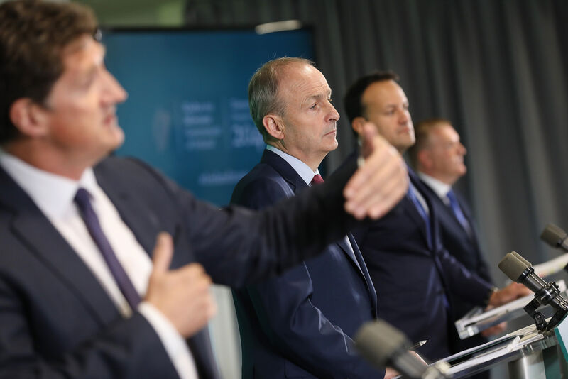 Transport Minister Eamon Ryan, Taoiseach Micheal Martin, Tanaiste and Minister for Enterprise, Trade and Employment Leo Varadkar, and Minister for Public Expenditure, Michael McGrath, during an event to launch Ireland's new national development plan at Pairc Ui Chaoimh in Cork. 