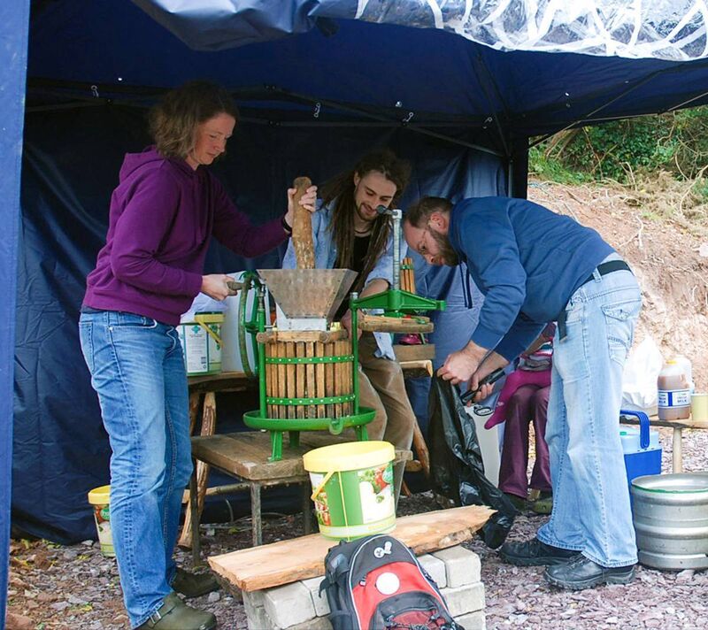 Volunteers making the pure apple juice.