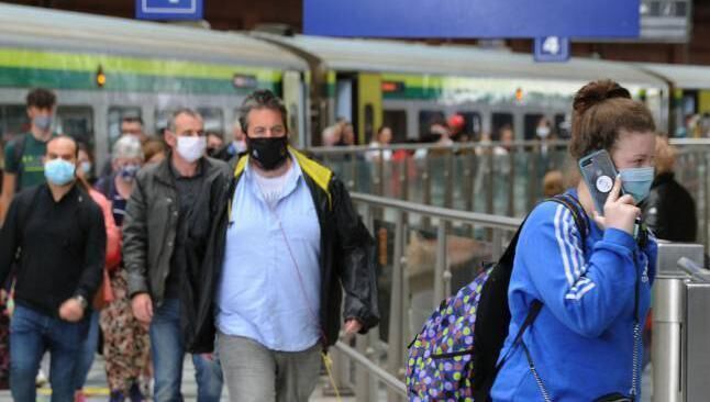 Passengers arriving at Kent Station in Cork from an Iarnród Eireann Inter-City train.