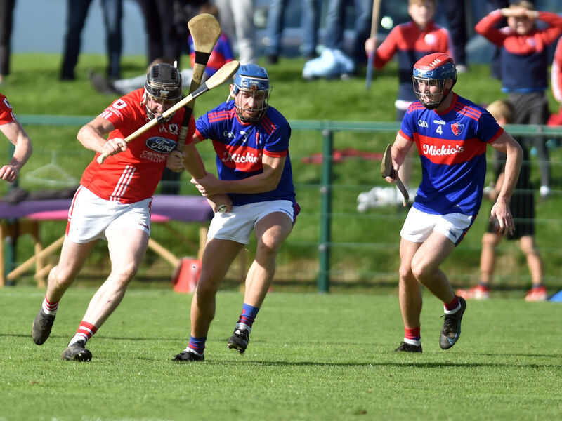 Charleville's Andrew Cagney bursting through Erin's Own's Cormac Dooley and Alan Moynihan during the Co-Op Superstores PSHC at Ballyclough. Picture: Eddie O'Hare