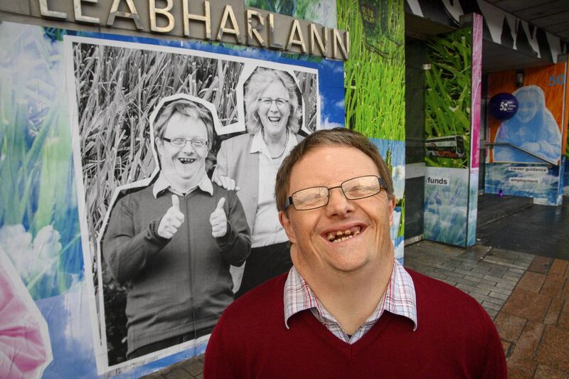 Pictured is John Sweetnam by his portrait with his mother Hazel at The Upside Mural at Cork City Library marking Down Syndrome Ireland’s 50th Anniversary. Picture: Daragh Mc Sweeney/Provision Pictured is John Sweetnam by his portrait with his mother Hazel at The Upside Mural at Cork City Library marking Down Syndrome Ireland’s 50th Anniversary. Picture: Daragh Mc Sweeney/Provision