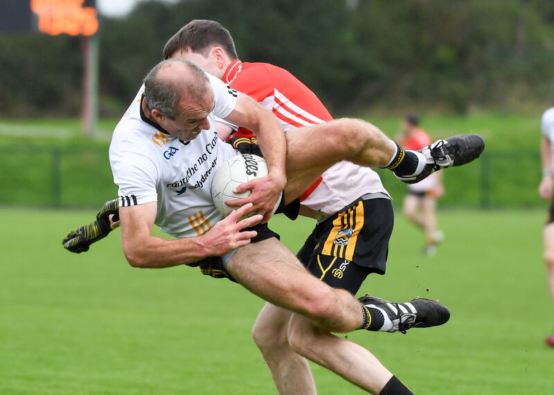 Clyda Rovers' Paudie Kissane is strongly challenged by Fermoy's Alan O'Connor. Picture: David Keane.