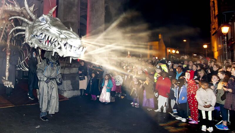 311014 The Dragon of Shandon Festival, Shandon Cork. The Finale of the Dragon of Shandon Festival in Cork City as the Dragon exits the Butter Exchange. Photo Andy Jay.