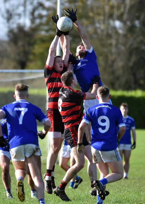 Newmarket's Tim Murphy and Naomh Abán's Conor O'Criodáin go high for the ball. Picture: Eddie O'Hare Newmarket's Tim Murphy and Naomh Abán's Conor O'Criodáin go high for the ball. Picture: Eddie O'Hare