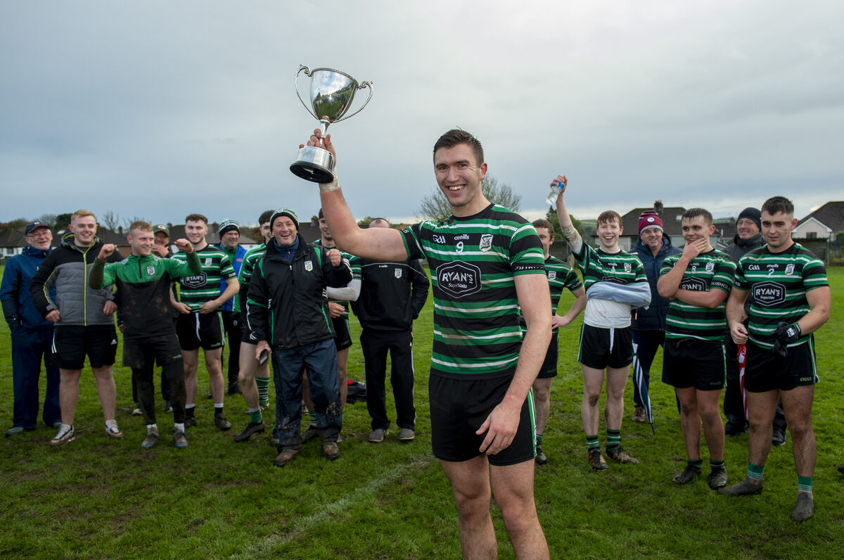 Eoin O'Sullivan the captain of the Douglas team holds the trophy aloft at Ballinlough. Picture Dan Linehan Eoin O'Sullivan the captain of the Douglas team holds the trophy aloft at Ballinlough. Picture Dan Linehan