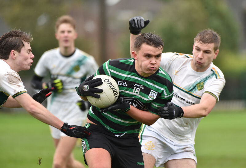  Conor Hanley and Sean Holland, St Michael's, looking to tackle Brendan Powter, Douglas. Picture: Dan Linehan