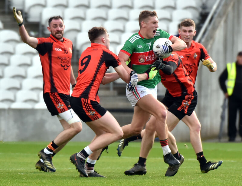 Clonakilty's Sean White is tackled by Duhallow's Joe Grimes and Jerry O'Connor. Picture: Eddie O'Hare