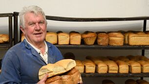 <p>Seanie Chamberlain, owner, Chamberlain's Shop &amp; Bakery, Mitchelstown, County Cork with some of the freshly baked traditional hand made bread. Picture: Denis Minihane.</p>