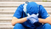 Serious, overworked, very sad male health care worker