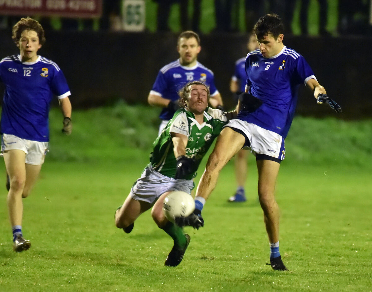 Aghinagh's Matthew McCarthy shoots as he is tackled by Ballincollig's Mattie O'Sullivan. Picture: Eddie O'Hare Aghinagh's Matthew McCarthy shoots as he is tackled by Ballincollig's Mattie O'Sullivan. Picture: Eddie O'Hare