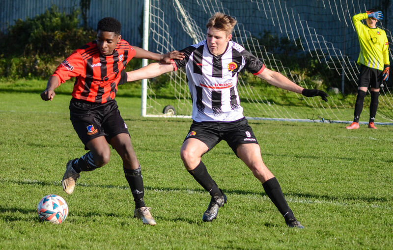 Ringmahon Rangers Bennett Mbowoua turns away from the challenge from Midleton's Brian Lynch during the recent CSL U16 National Cup game at Knockgriffin Park. Picture: Howard Crowdy