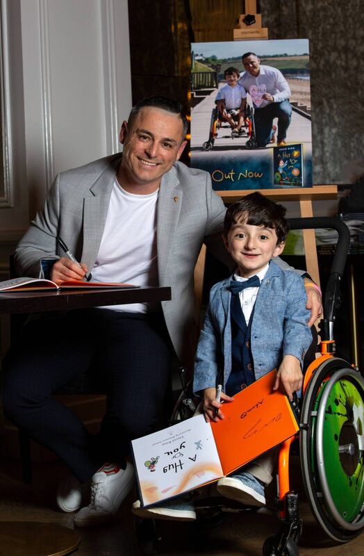 Children's author David King with son, Adam King at the signing of his new book, 'A Hug For You'. Photo by: Shaunagh O'Connell Children's author David King with son, Adam King at the signing of his new book, 'A Hug For You'. Photo by: Shaunagh O'Connell
