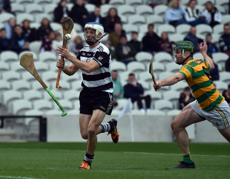 Midleton's Luke O'Farrell breaks from Blackrock's Cathal Cormack and a flying hurley at Páirc Uí Chaoimh. Picture: Eddie O'Hare