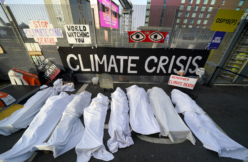 Climate activists dressed as shrouded bodies take part in a protest outside the Cop26 summit in Glasgow. Climate activists dressed as shrouded bodies take part in a protest outside the Cop26 summit in Glasgow.